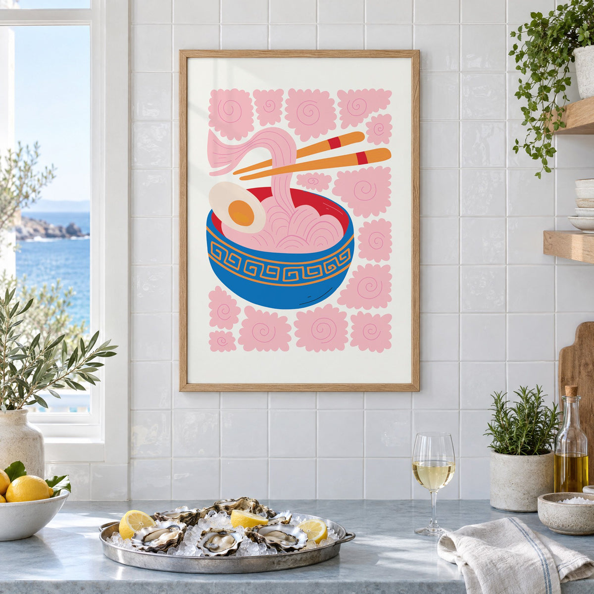 ramen noodles chopsticks pink swirl print in an oak frame on white tiles above a marble counter with oysters and lemons by a sea view