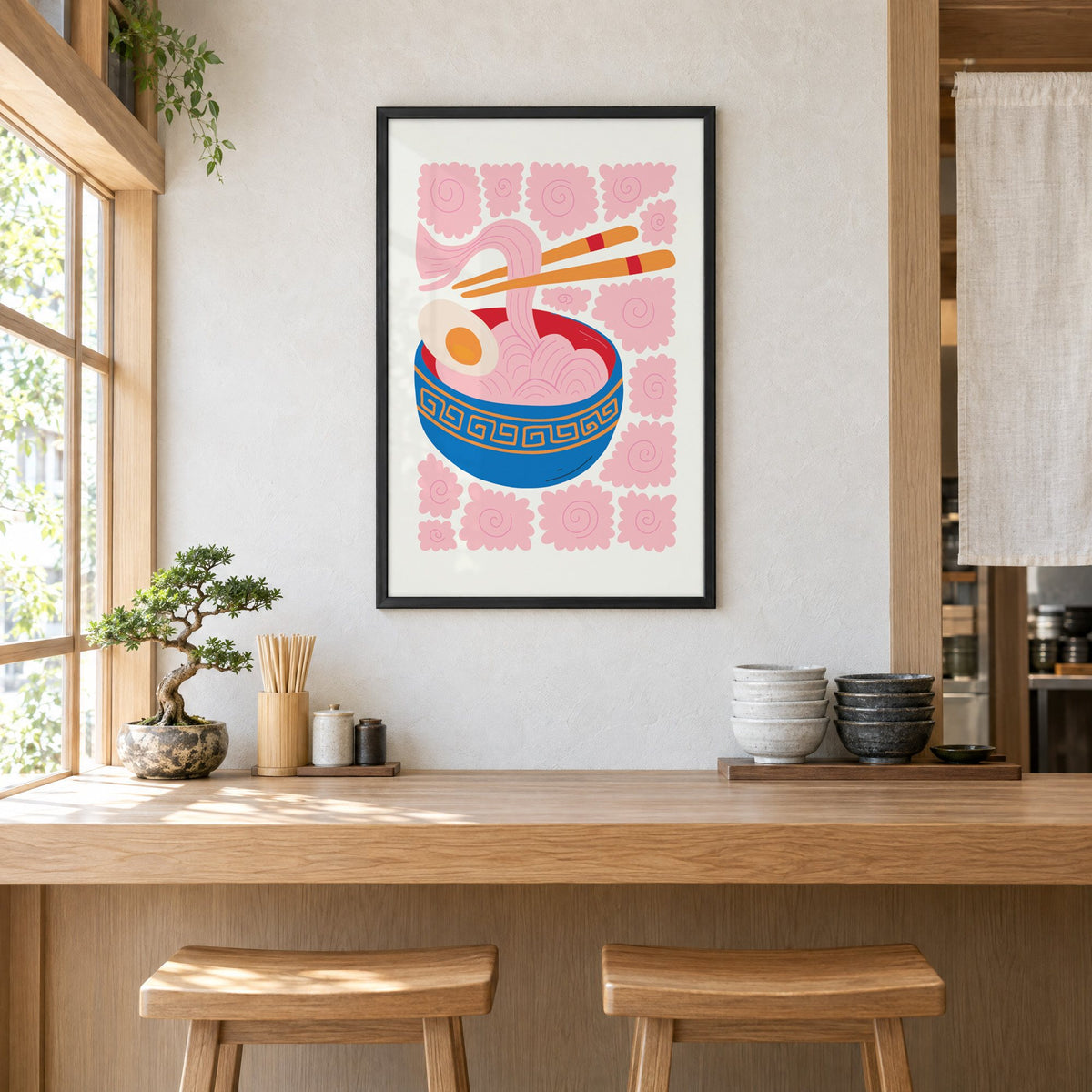 ramen noodles chopsticks pink swirl print in a black frame above a light wood ramen counter with stools and stacked bowls