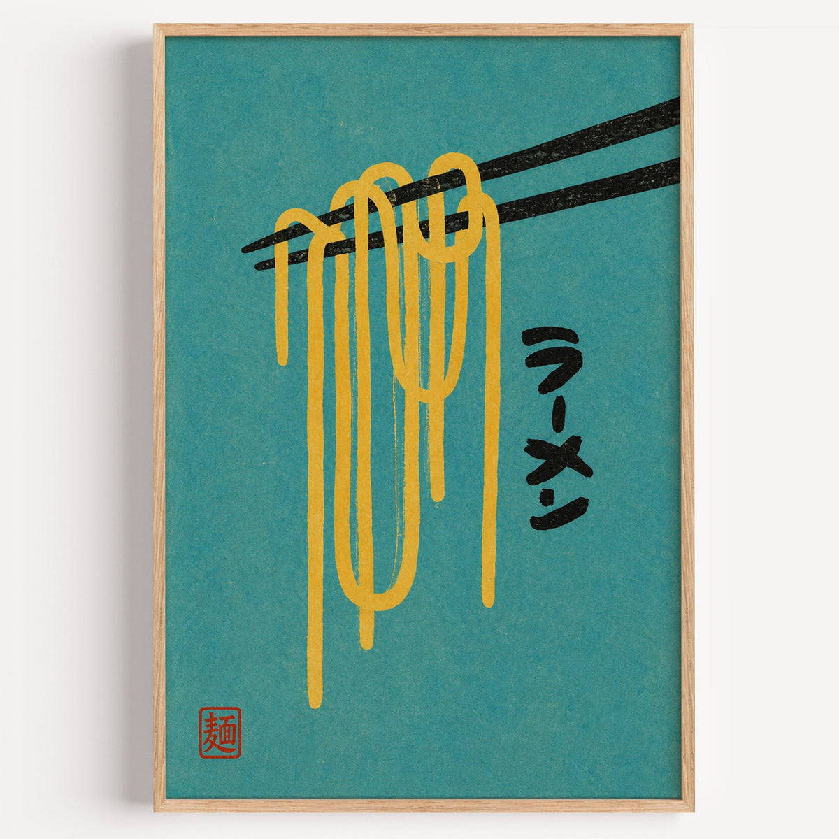 ramen noodles and chopsticks on teal print in a light oak frame on a plain white wall
