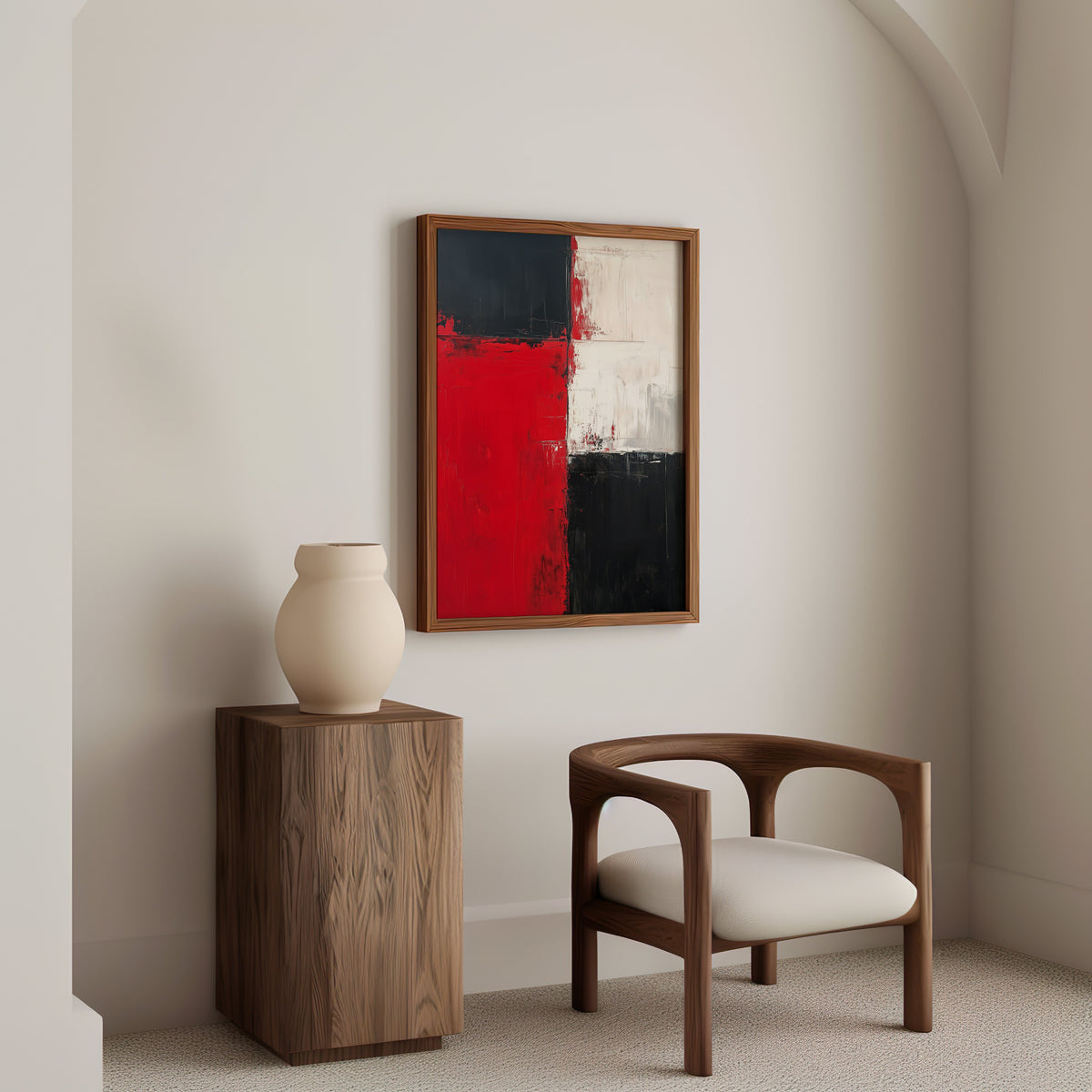 Red, black and white color block abstract print in a walnut frame above a wood pedestal and a curved walnut armchair
