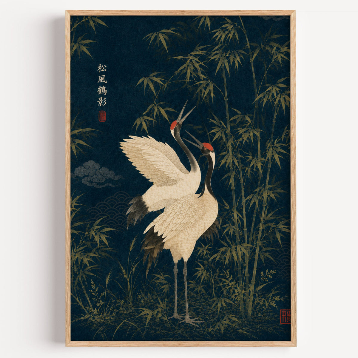 red-crowned cranes and bamboo on navy print in a light oak frame on a plain white wall