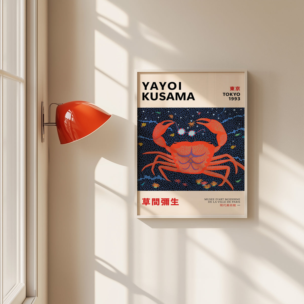 Yayoi Kusama inspired red dotted crab print in a white frame by a red wall lamp