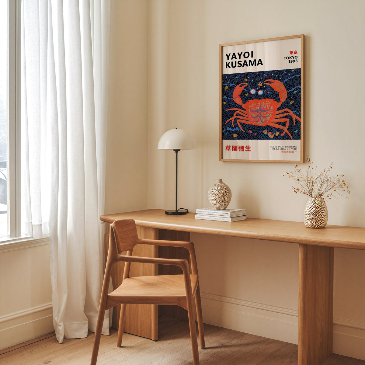Yayoi Kusama inspired red dotted crab print above a desk with a dome lamp