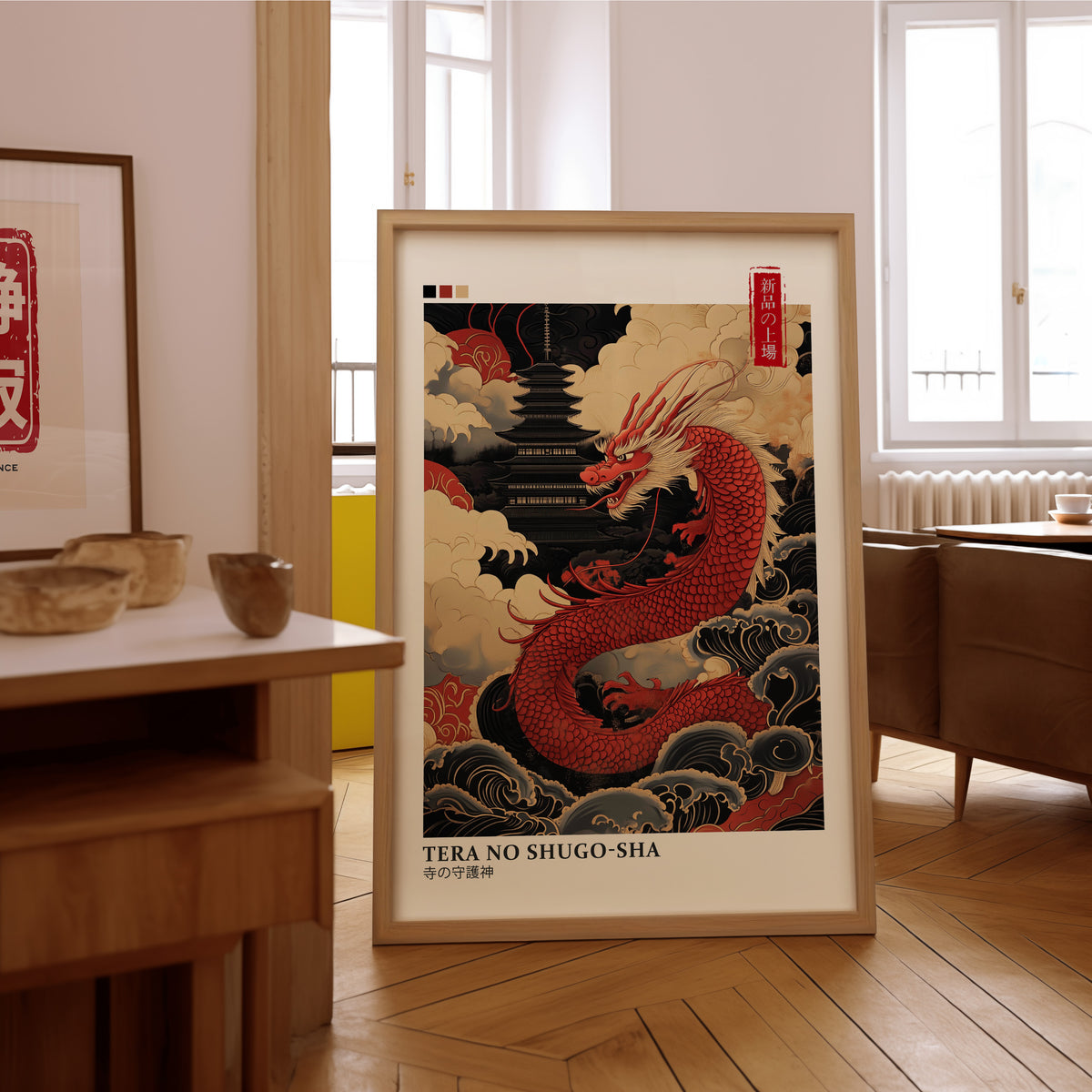 Red dragon guarding black pagoda print in an oak frame on the parquet floor of a sunlit living room