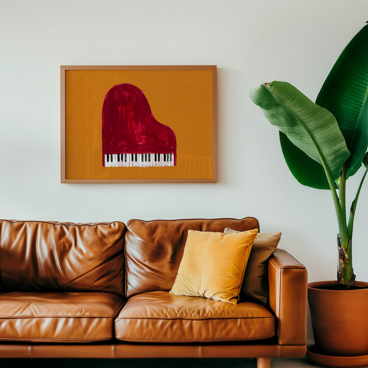 Piano music wall art print in an oak frame above a cognac leather sofa