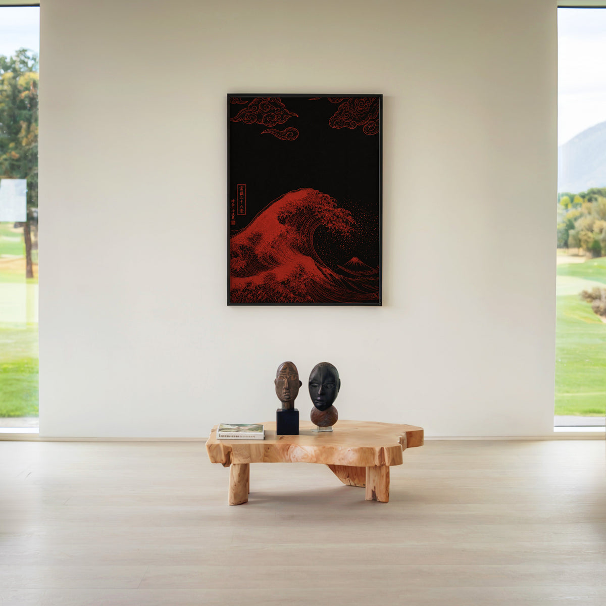 red Great Wave on black print in a black frame above a live-edge wood coffee table between garden windows