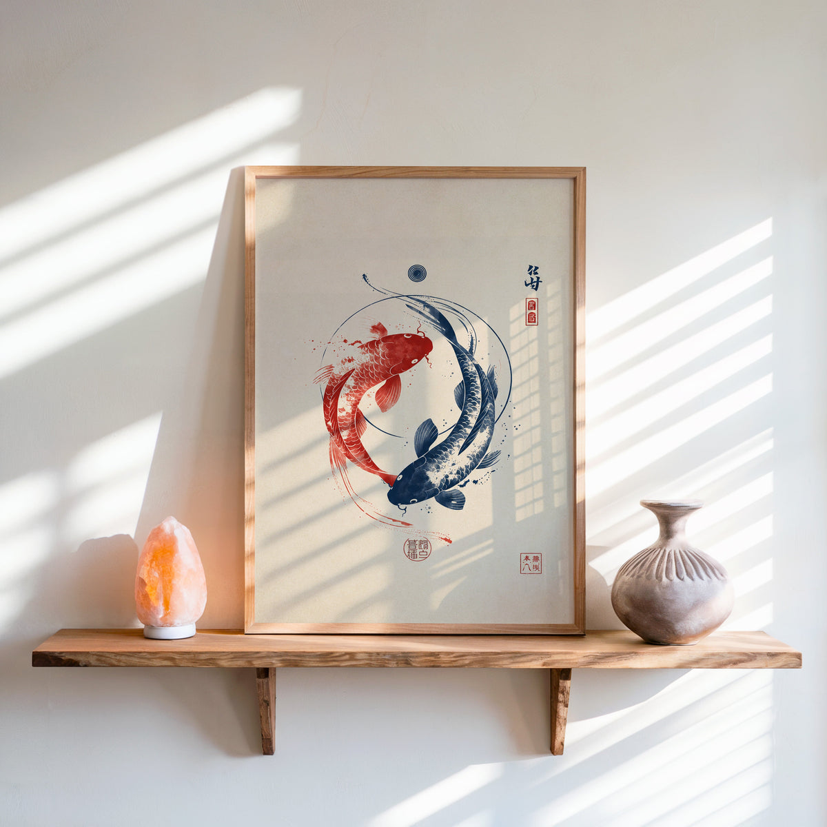 red and navy koi in a circle print in an oak frame on a live-edge wall shelf with a salt lamp and clay vase