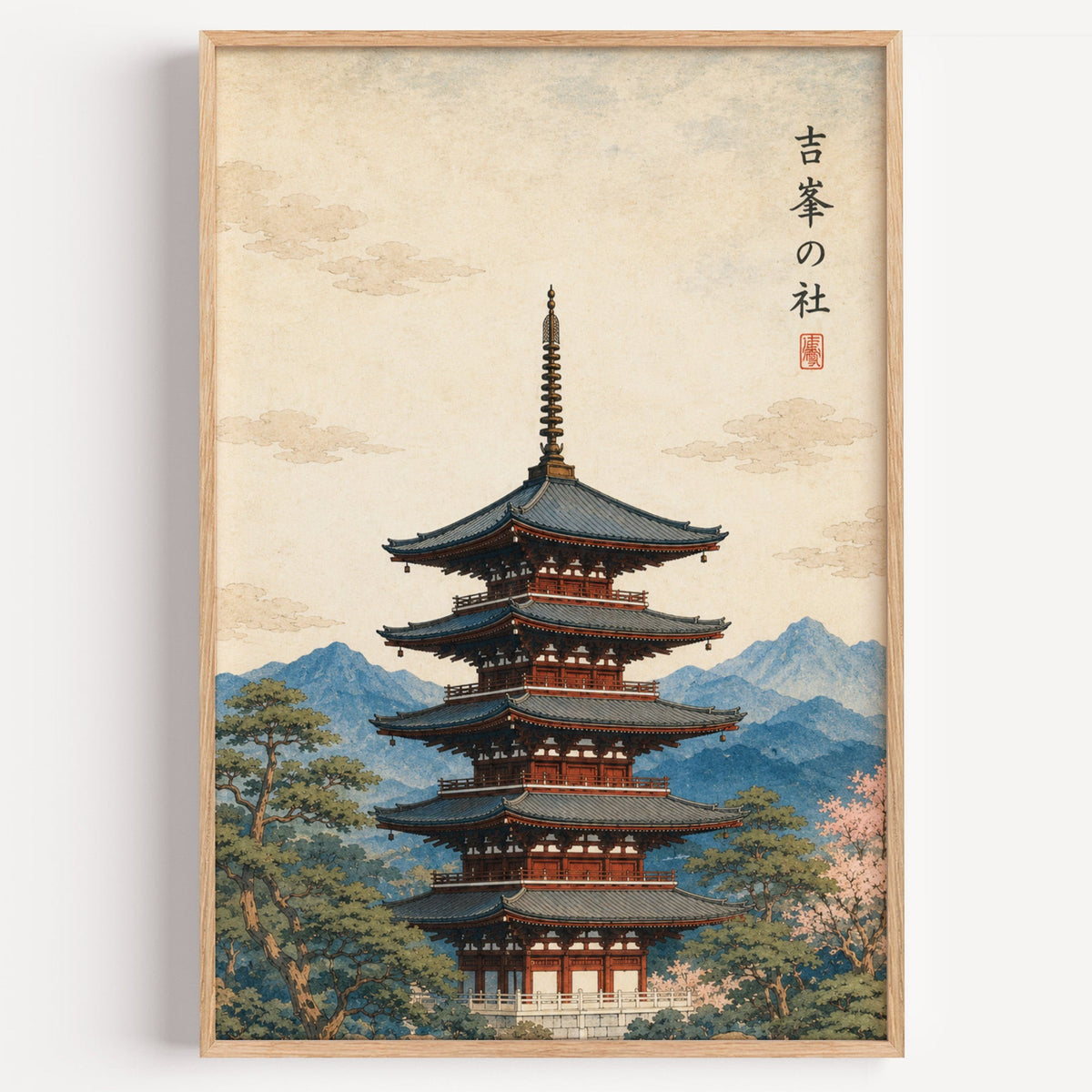red pagoda with blue mountains print in a light oak frame on a plain white wall