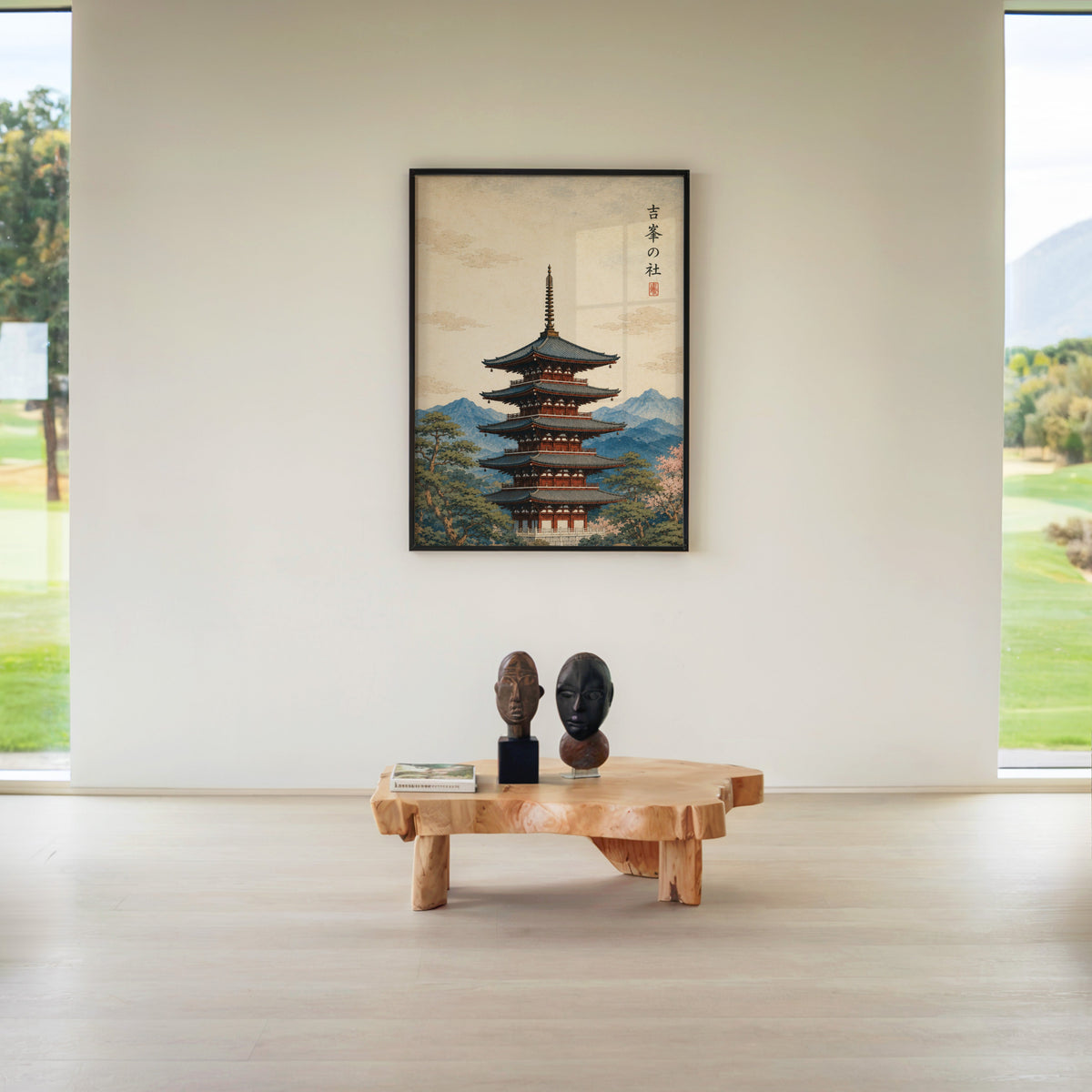 red pagoda with blue mountains print in a black frame above a live-edge wood coffee table between garden windows