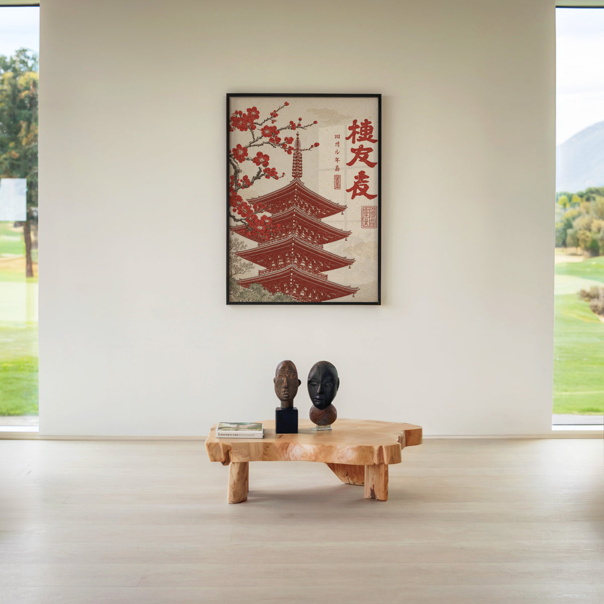red engraved pagoda with blossom branch print in a black frame above a live-edge wood coffee table between garden windows