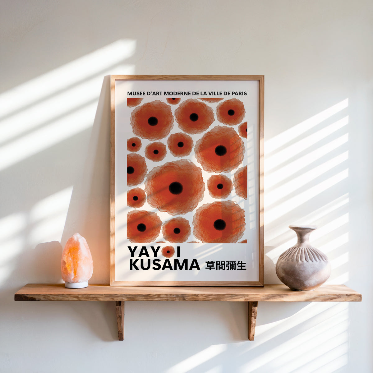 Yayoi Kusama inspired red poppy dot print above a shelf with a salt lamp