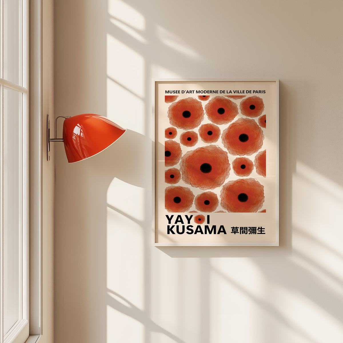 Yayoi Kusama inspired red poppy dot print in a white frame by a red wall lamp