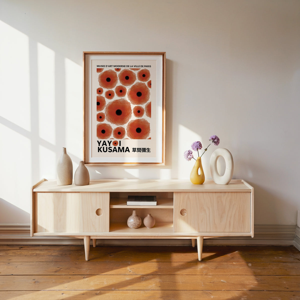Yayoi Kusama inspired red poppy dot print above a pale wood console