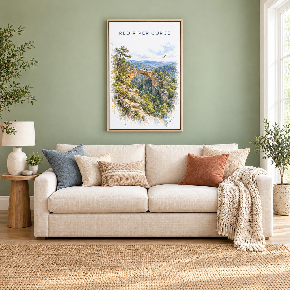 Red River Gorge watercolor print as a natural floater canvas above a cream linen sofa on a sage green wall