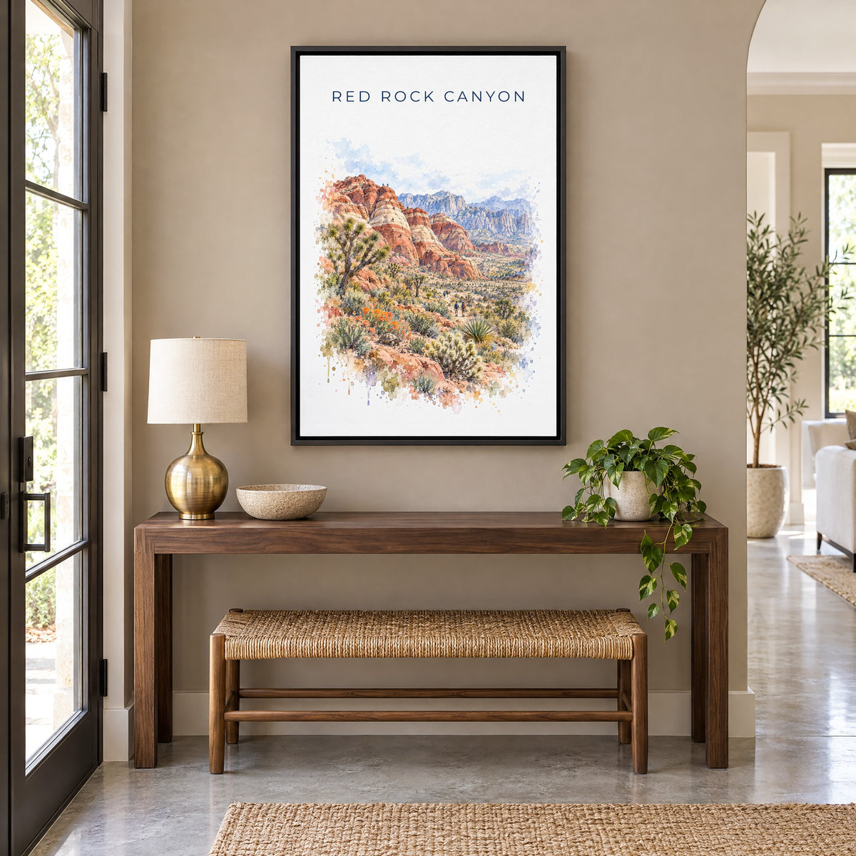 Red Rock Canyon National Conservation Area watercolor as a black floater canvas above a walnut console and woven bench in an
