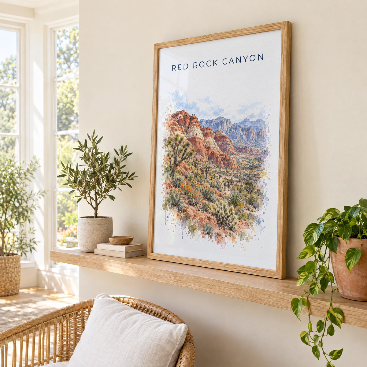 Red Rock Canyon National Conservation Area watercolor print in an oak frame on a picture ledge in a sunlit sunroom