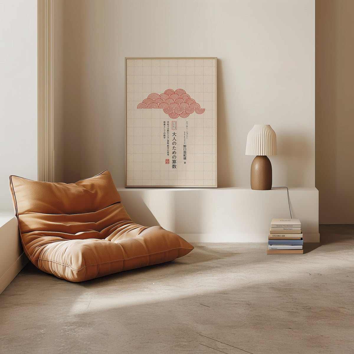 red seigaiha cloud on grid paper print in a light oak frame on a white ledge by a tan leather floor chair