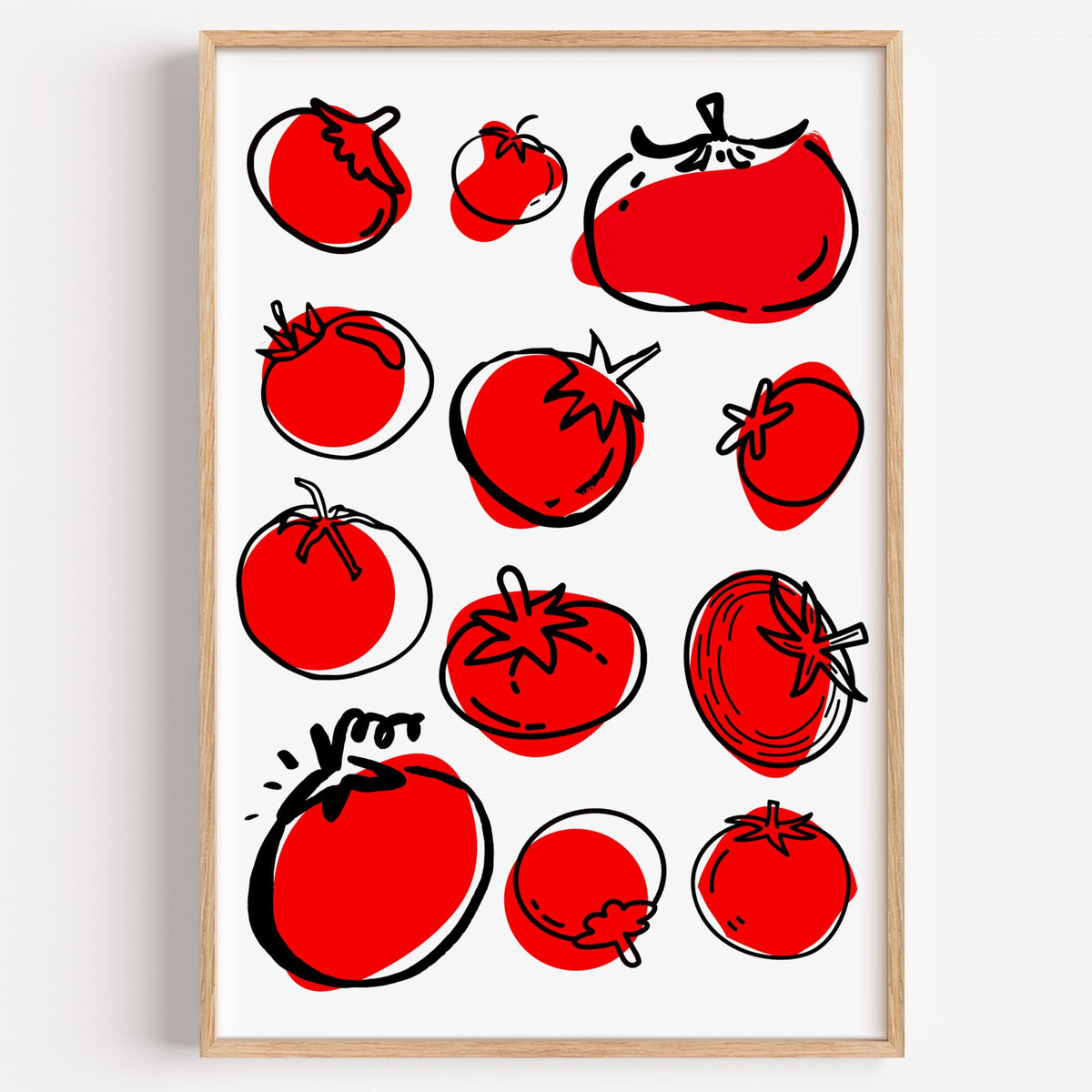 Red tomatoes ink sketch print in a light oak frame on a plain white wall