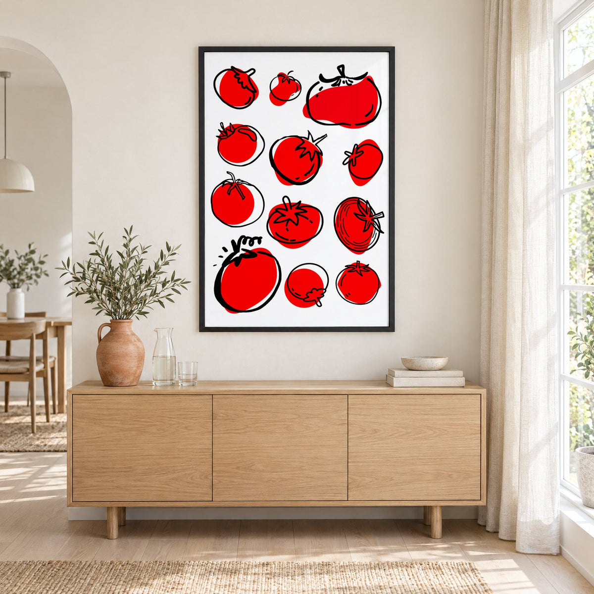 Red tomatoes ink sketch print in a black frame above an oak sideboard with a terracotta vase of olive branches
