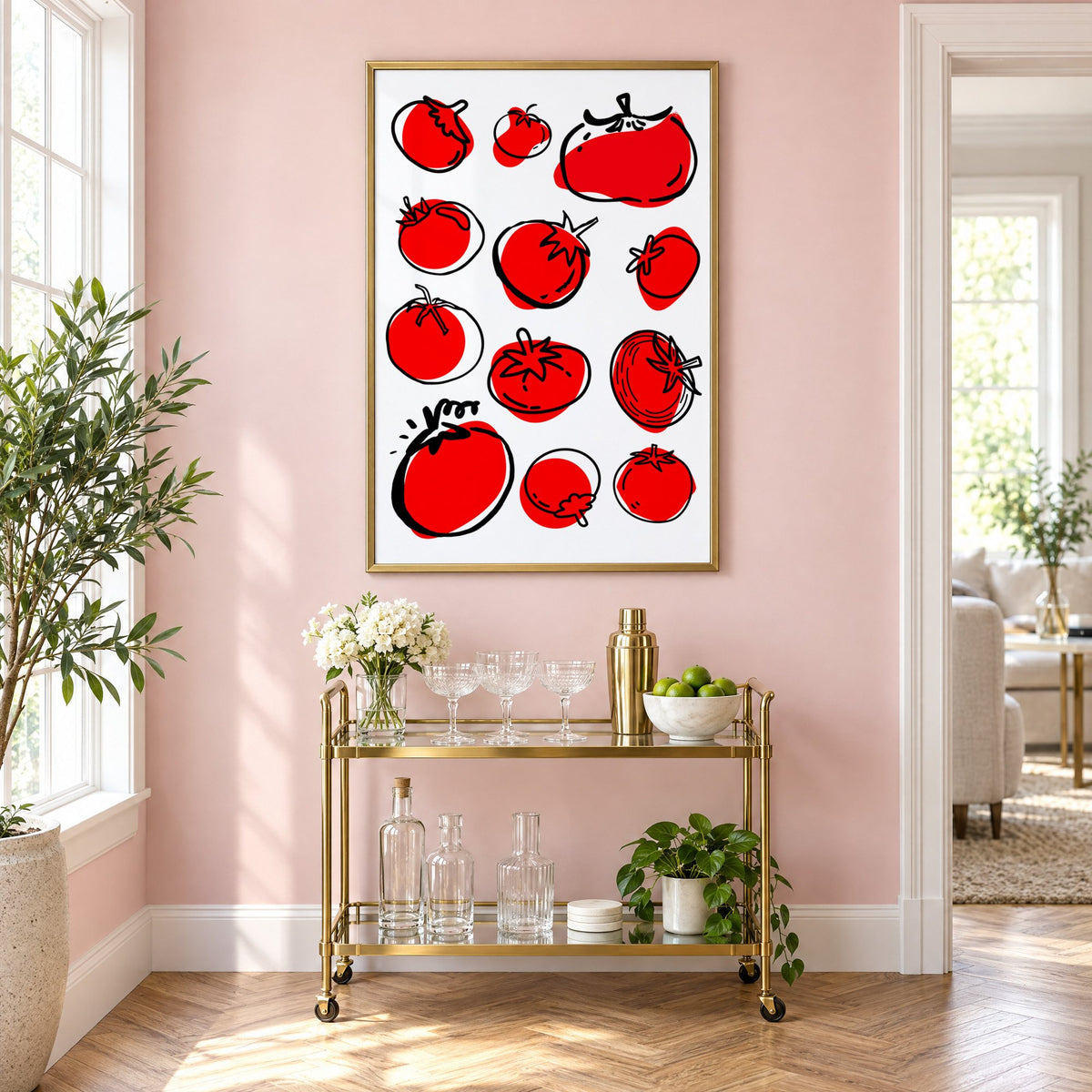 Red tomatoes ink sketch print in a brass frame above a gold bar cart on a blush pink wall