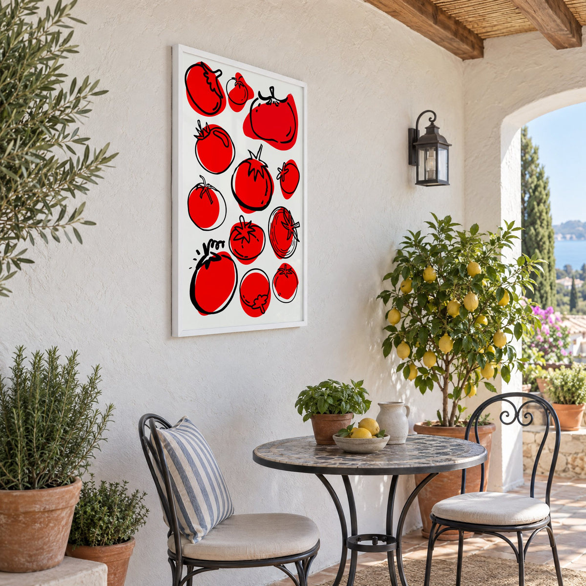 Red tomatoes offset line pattern print in a white frame on a sunny patio wall beside a potted lemon tree