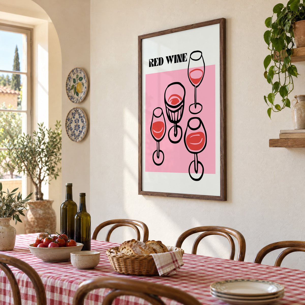 RED WINE four glasses pink print in a walnut frame above a gingham-covered trattoria table, seen at an angle