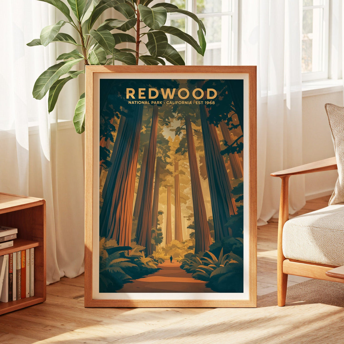 Redwood National Park print in an oak frame by a sunlit window with sheer curtains and a fig plant