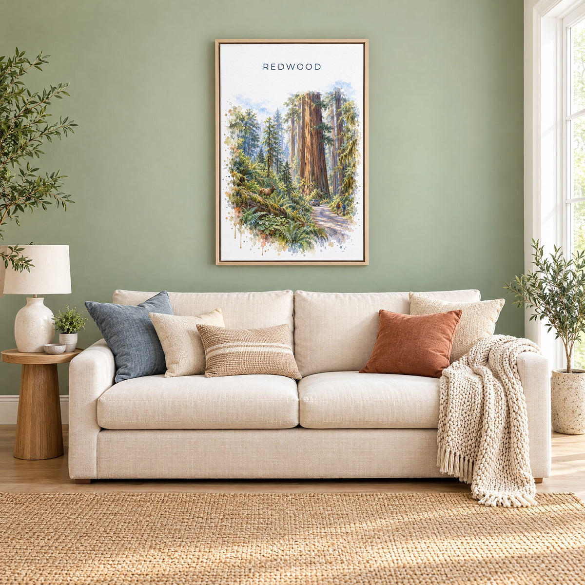 Redwood National Park watercolor print as a natural floater canvas above a cream linen sofa on a sage green wall