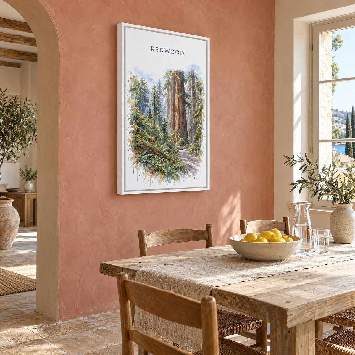 Redwood National Park watercolor print as a white floater canvas on a terracotta wall above a rustic dining table