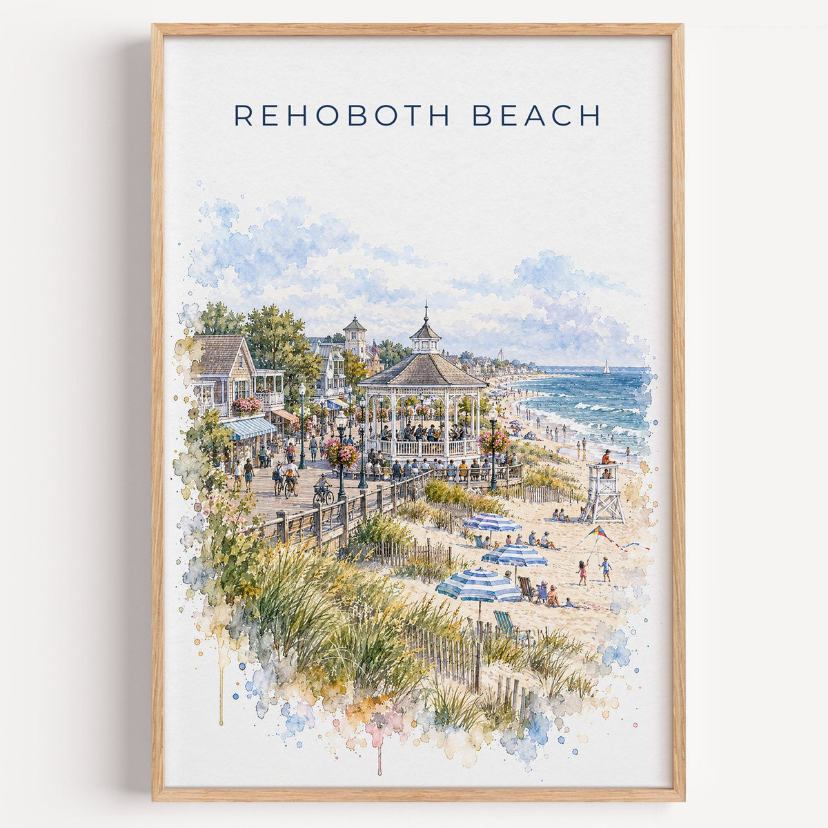 Rehoboth Beach watercolor print in a light oak frame on a plain white wall