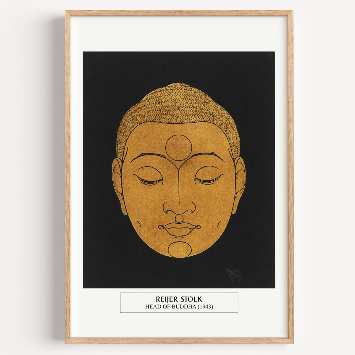 Reijer Stolk Head of Buddha print in a light oak frame on a plain white wall