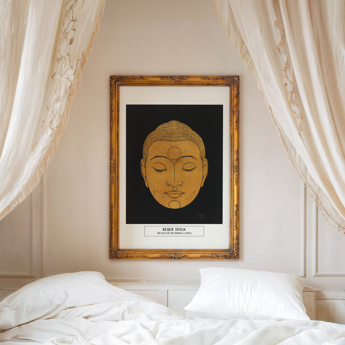Head of Buddha print shown in an ornate gold frame above a canopy bed