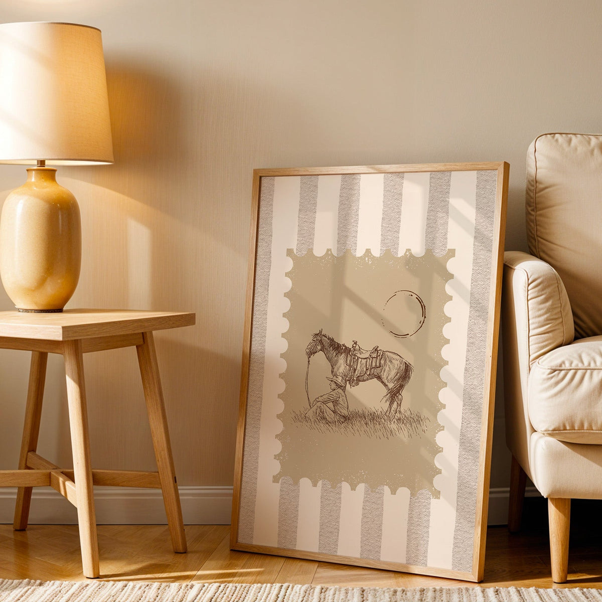 Resting horse stamp print in an oak frame beside an amber ceramic lamp