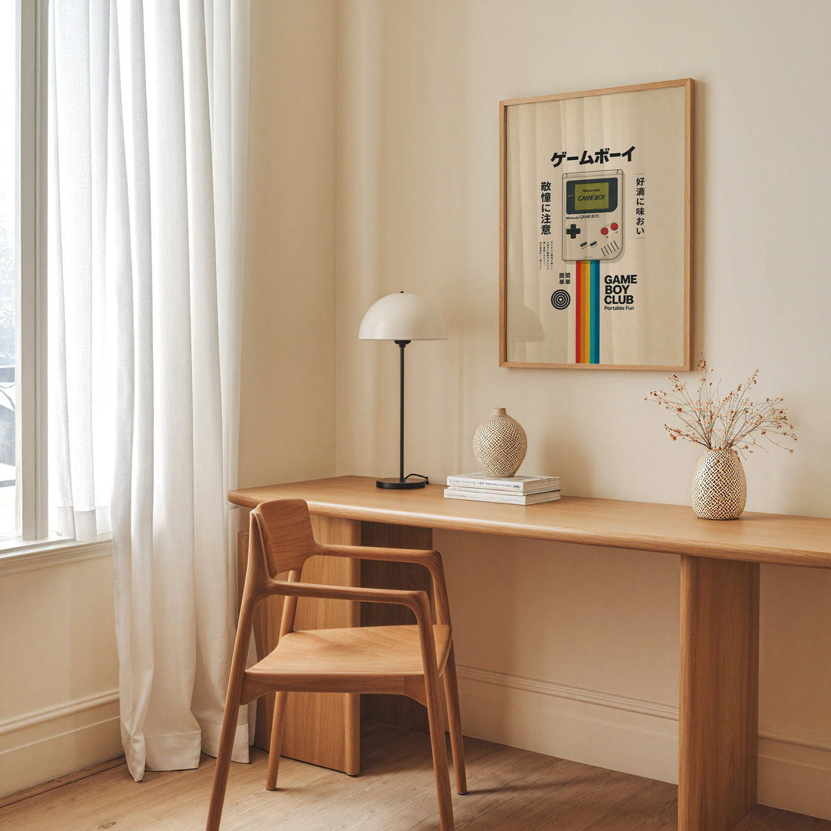 retro handheld game console with rainbow print in an oak frame above a long oak desk with a white dome lamp and woven vases