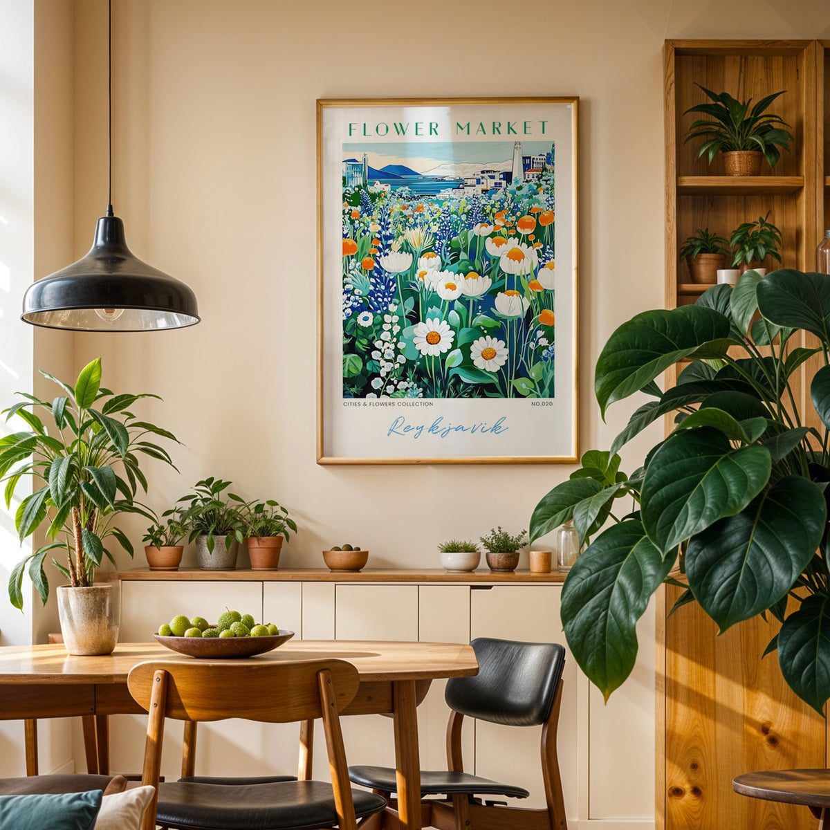 Reykjavik flower market print in an oak frame above a dining sideboard lined with potted plants