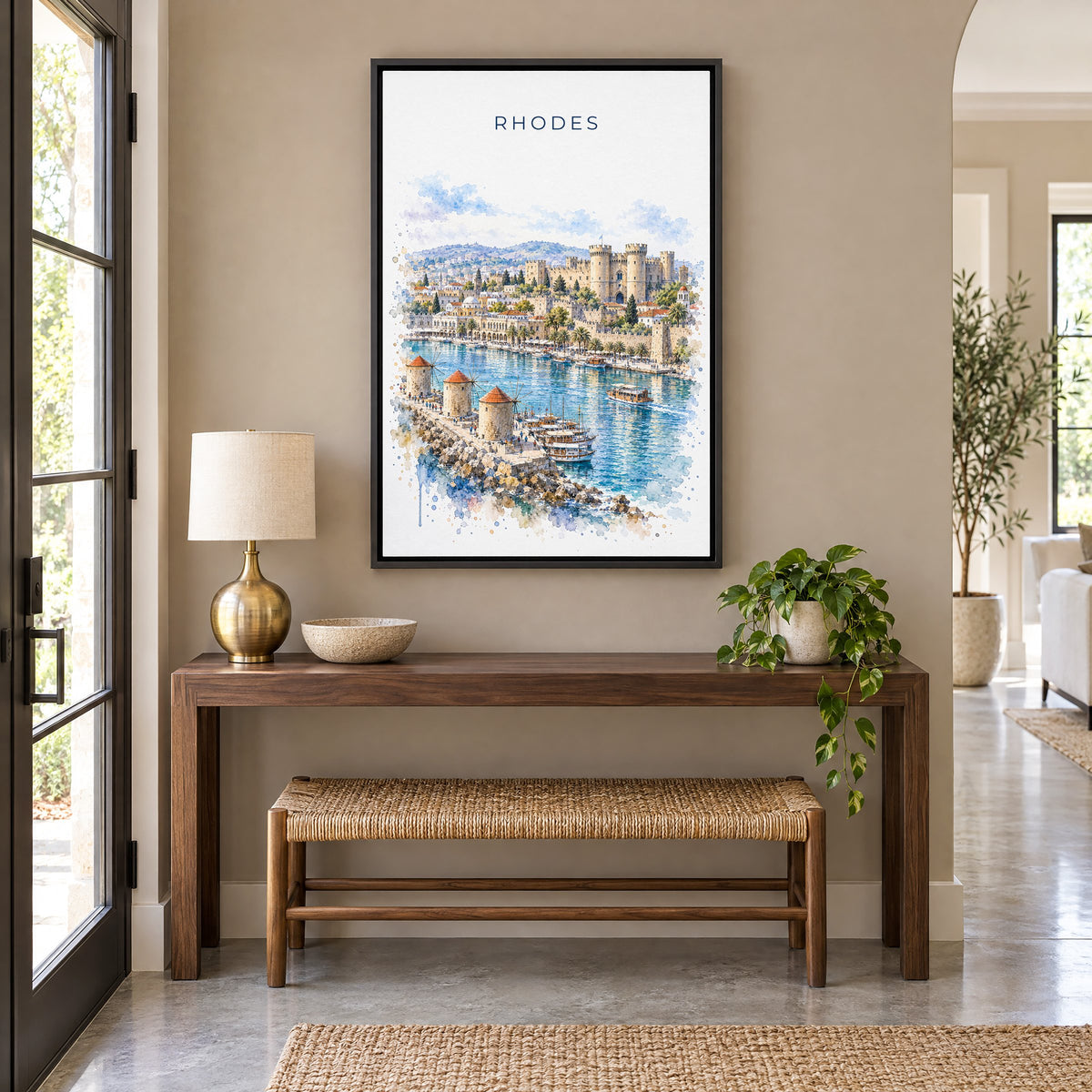 Rhodes watercolor print as a black floater canvas above a walnut console and woven bench in an entryway