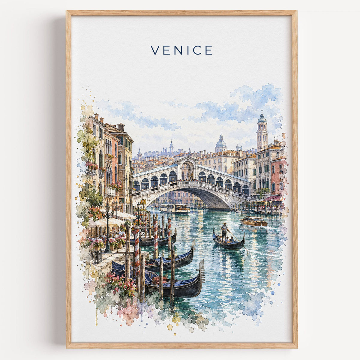 Rialto Bridge watercolor print in a light oak frame on a plain white wall