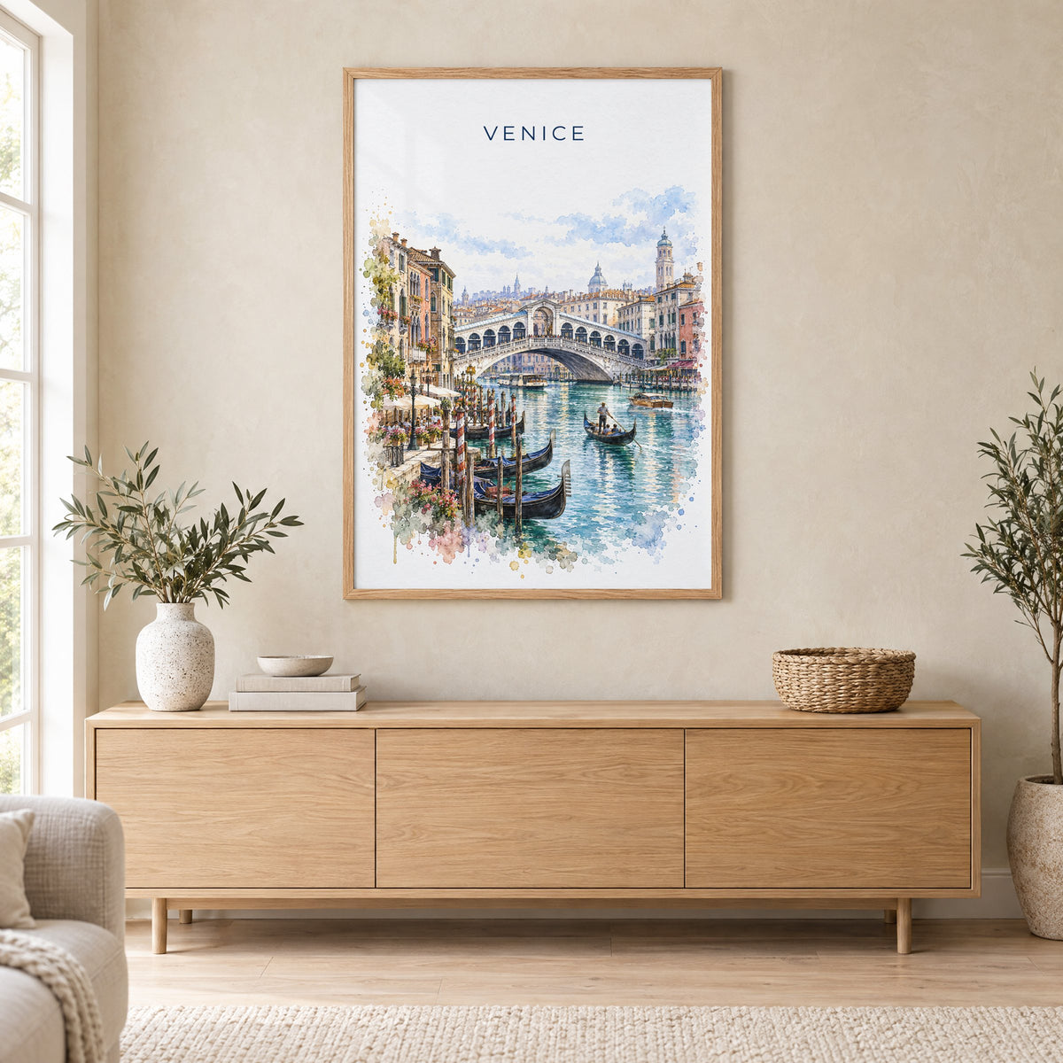Rialto Bridge watercolor print in an oak frame above a light wood sideboard in a Scandinavian living room