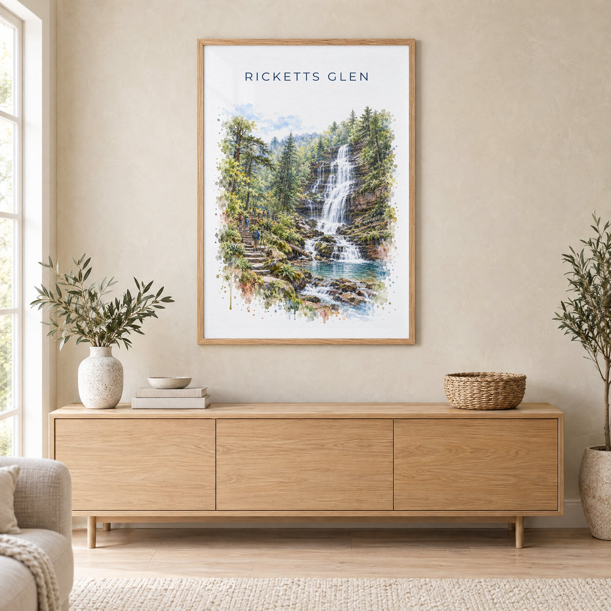 Ricketts Glen State Park watercolor print in an oak frame above a light wood sideboard in a Scandinavian living room