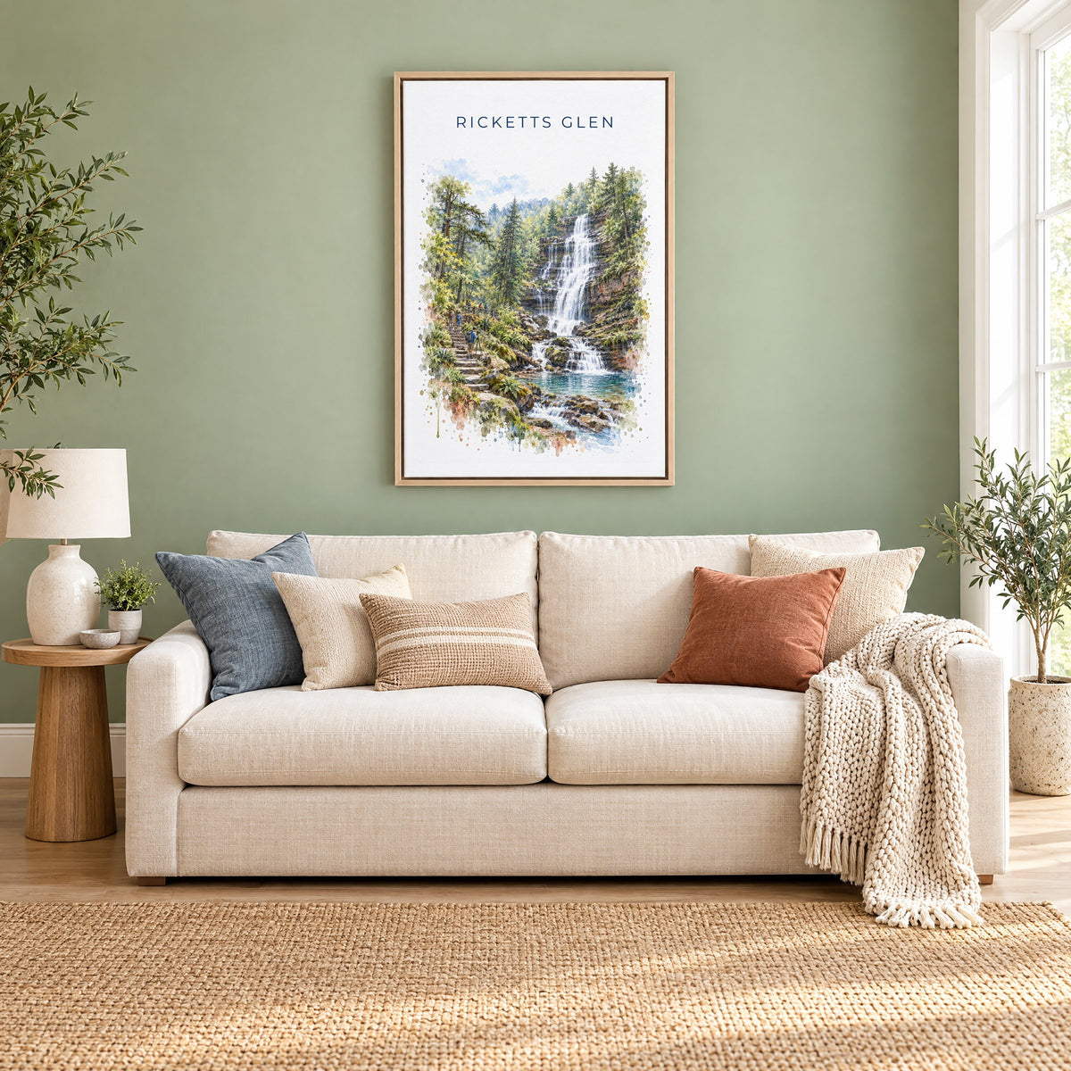Ricketts Glen State Park watercolor print as a natural floater canvas above a cream linen sofa on a sage green wall