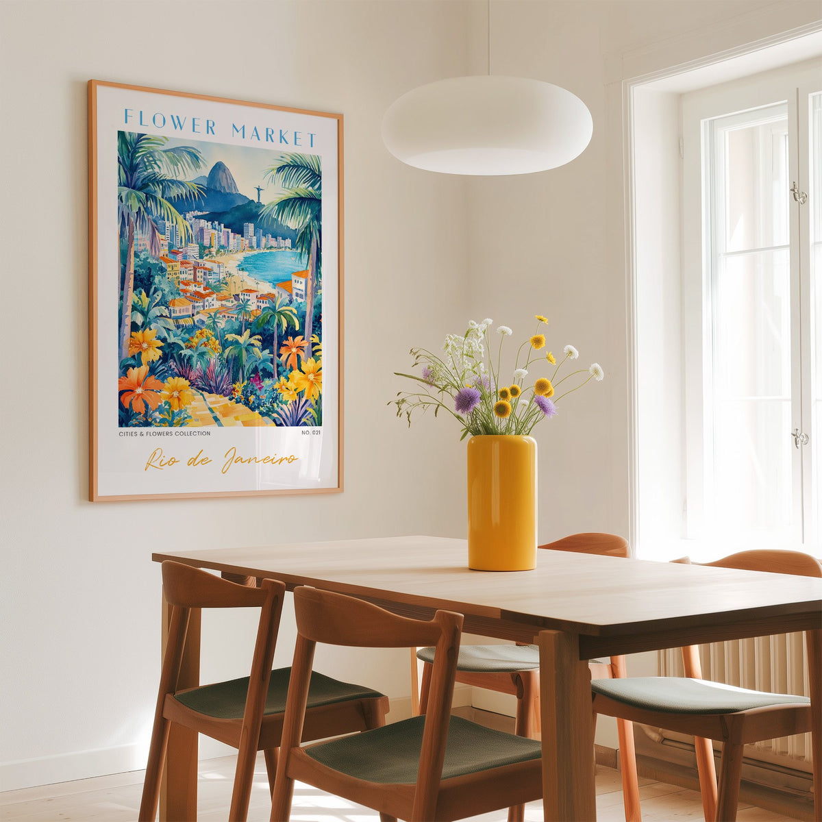 Rio de Janeiro flower market print in an oak frame above a dining table with a yellow vase and white pendant light