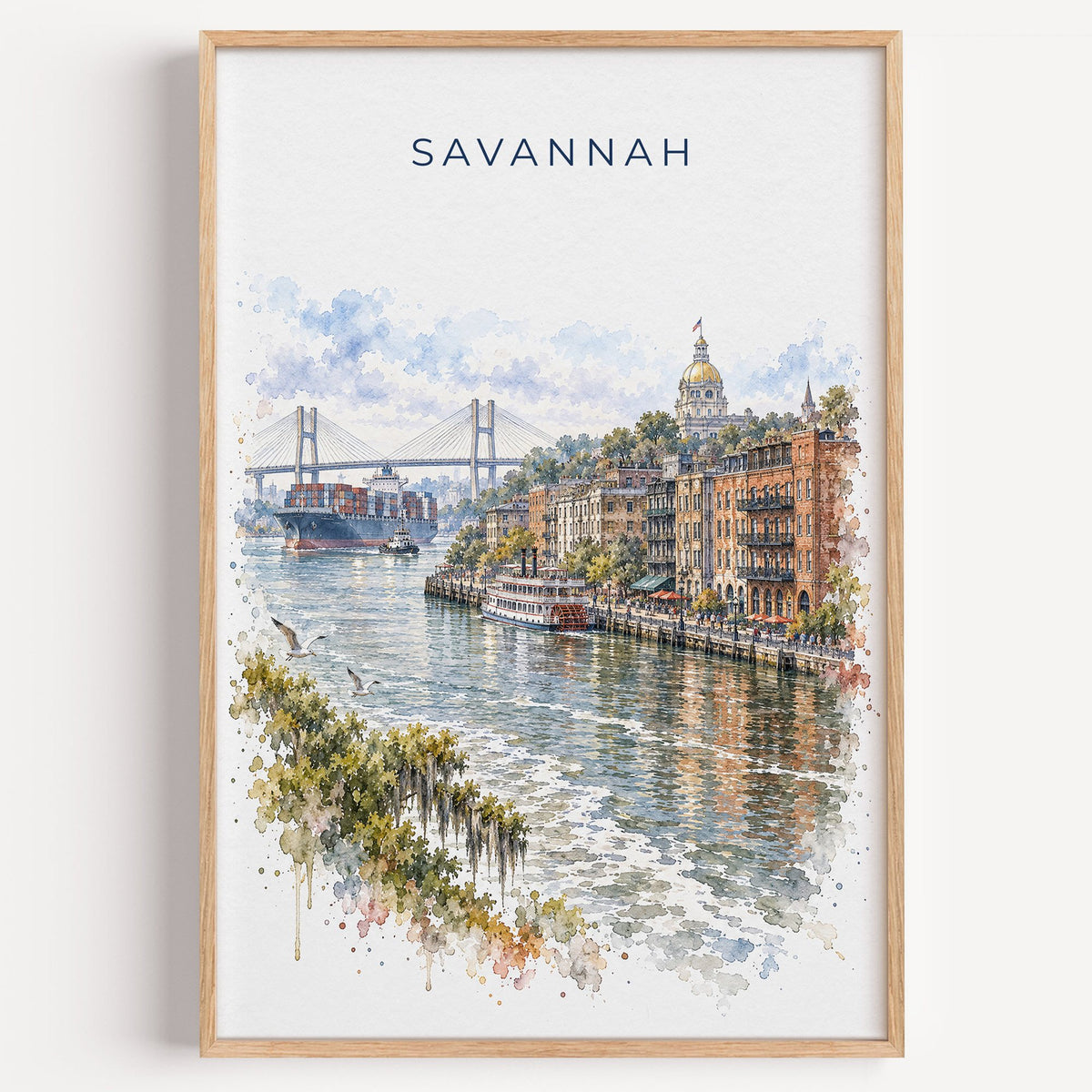 River Street Savannah watercolor print in a light oak frame on a plain white wall