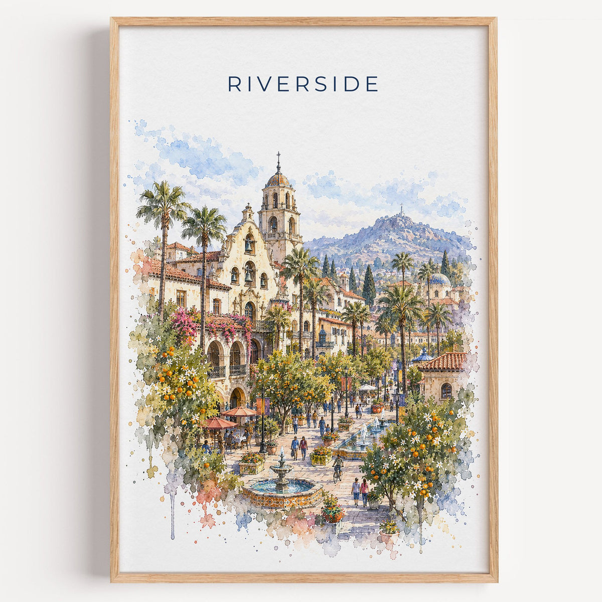Riverside, California watercolor print in a light oak frame on a plain white wall