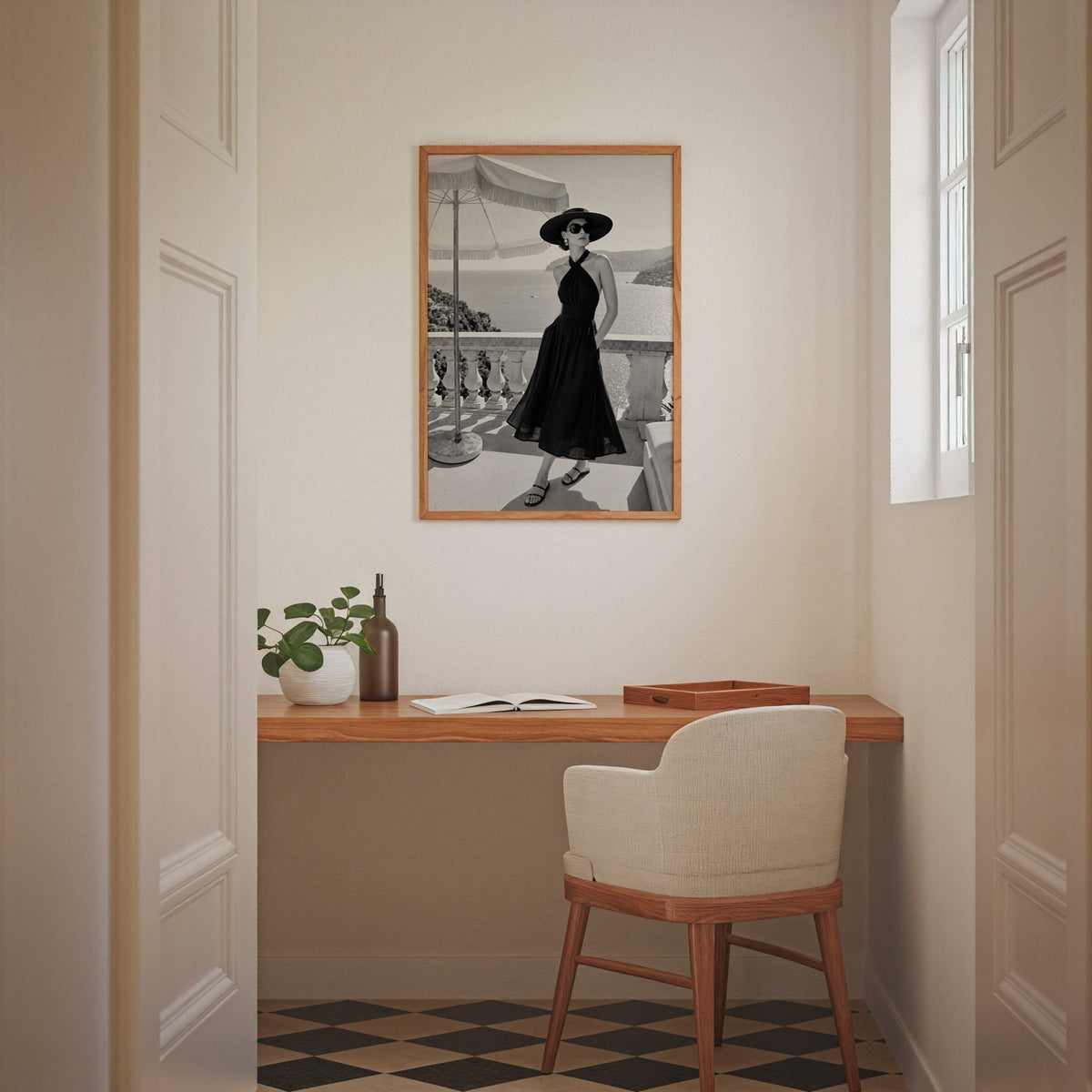 Black and white woman in halter dress on terrace print in an oak frame above a home office desk nook