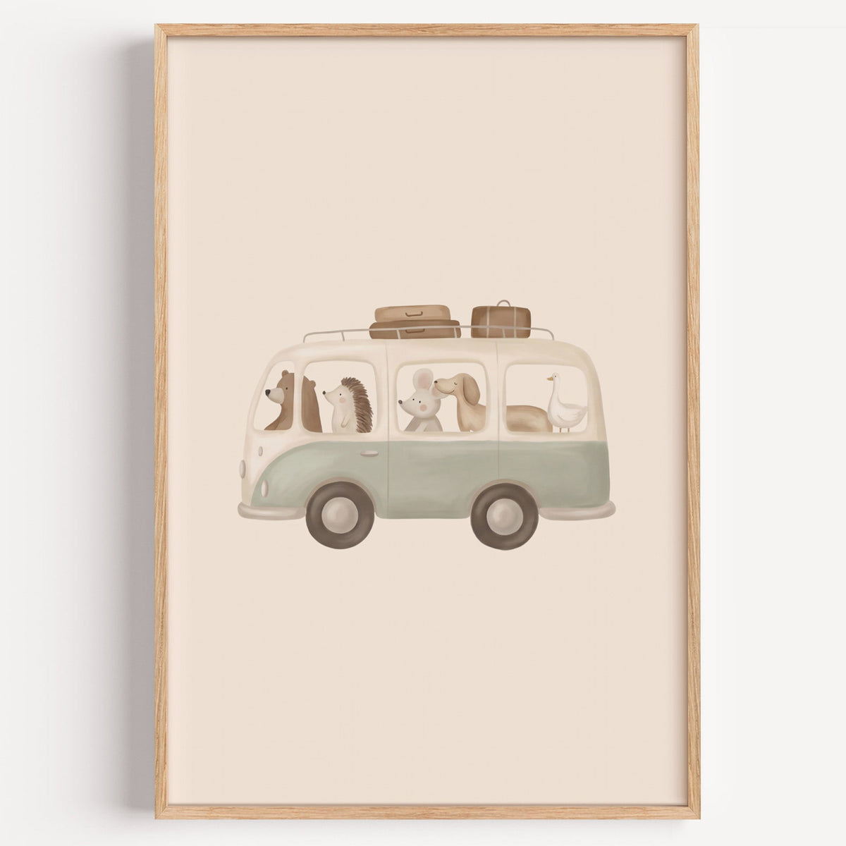 Animals riding in a sage camper van nursery print in a light oak frame on a plain white wall