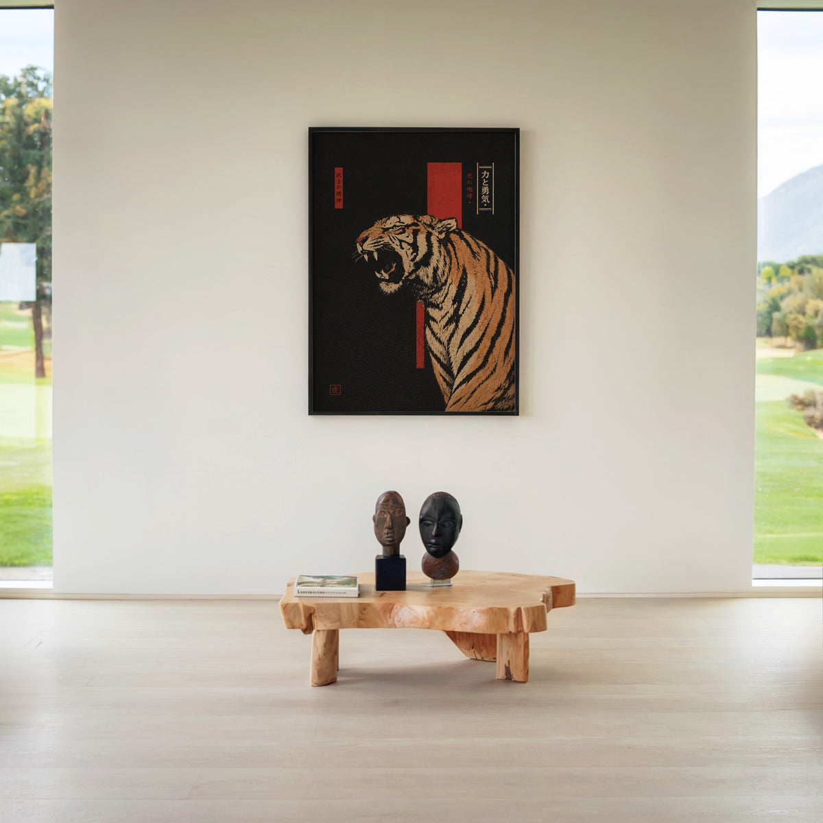 roaring tiger on black with red banner print in a black frame above a live-edge wood coffee table between garden windows
