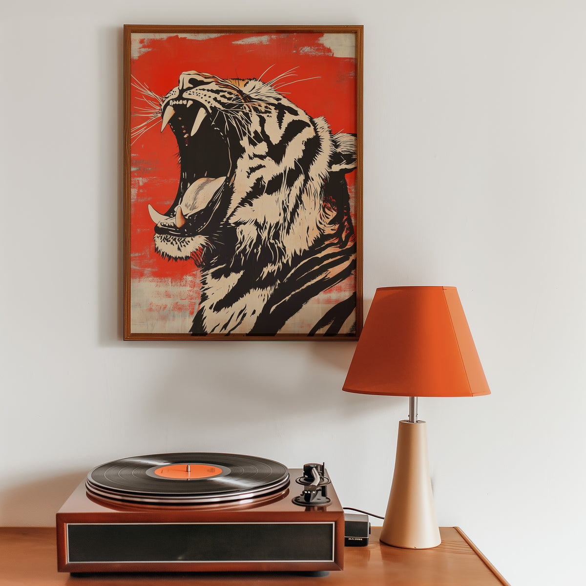 Roaring tiger head in profile print in a walnut frame above a sideboard with a record player