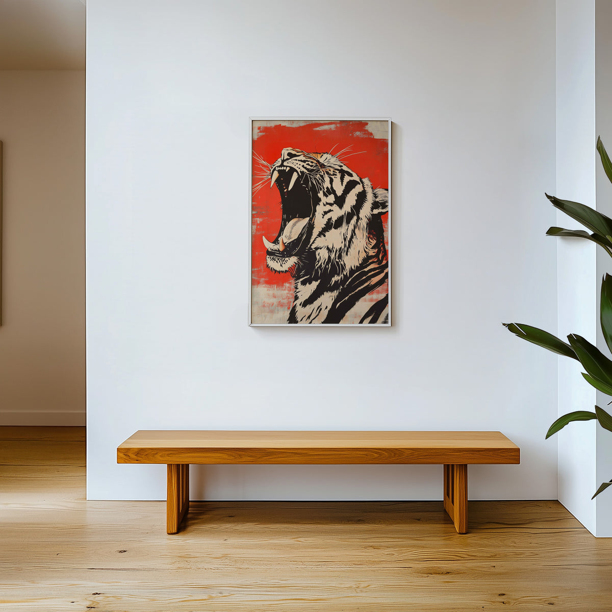 Roaring tiger head in profile print shown in a white frame above a wooden entryway bench