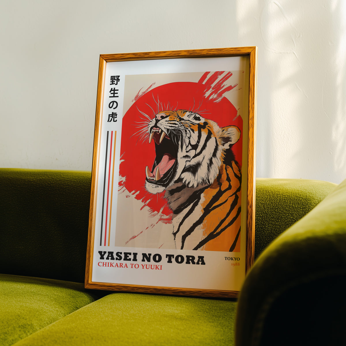 Roaring tiger with red sun print in an oak frame propped on a green velvet sofa