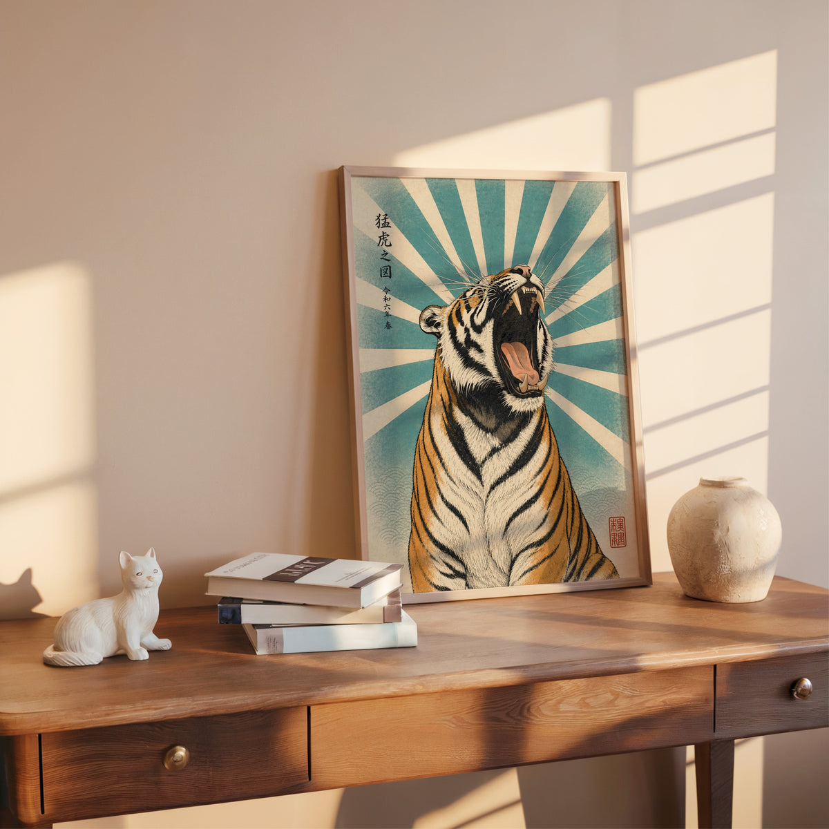 roaring tiger with teal sunburst print shown in a rose gold frame leaning on a wooden writing desk with books